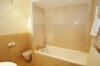 Good looking ... The master bathroom is furnished with Starck fittings and the luxury of limestone at 38 Le Bollin.